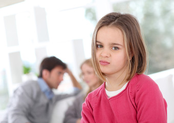 Portrait of bored little girl at home
