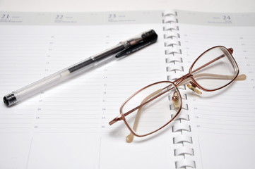 glasses and pen