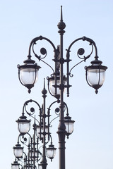 Line of many retro styled lanterns isolated ob blue