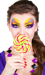 portrait of a beautiful woman with make up and candy