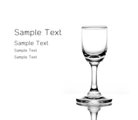 Empty glass of martini  on white background sharp light and refl