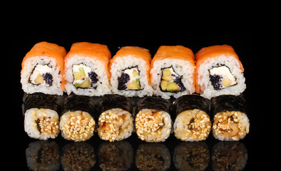 Tasty rolls in line isolated on black