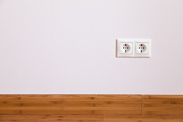 Interior wall with domestic power outlet