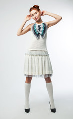 Elegant asian woman in fashion retro dress posing