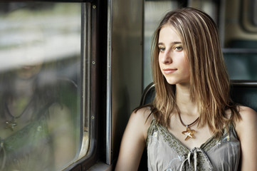 Young woman sitting in the train