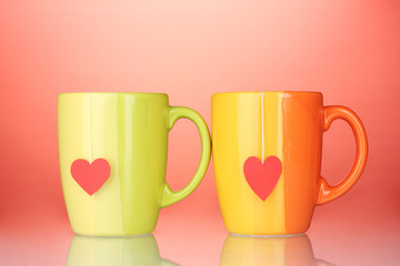 Two cups and tea bags with red heart-shaped label