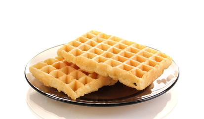 Sweet waffles on plate isolated on white