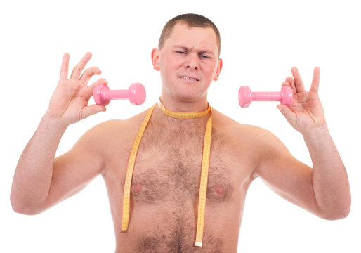 Young man with dumbbells and measure on white background.