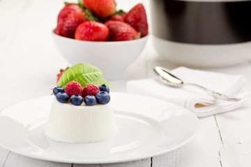 Panna cotta with Berries on white table