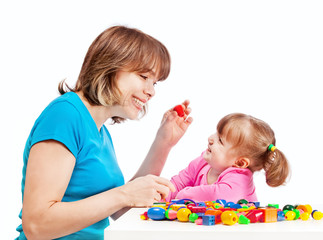 Obraz na płótnie Canvas Mom plays with her daughter