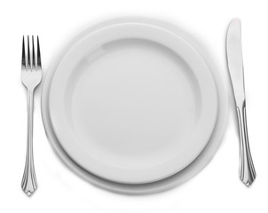 White empty plate with fork and knife isolated on white