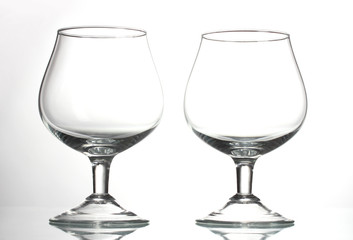 Two empty glasses isolated on white