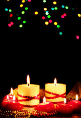 Beautiful candles on wooden table on bright background