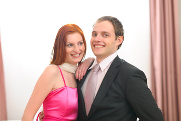 Portraits of formally dressed young couple
