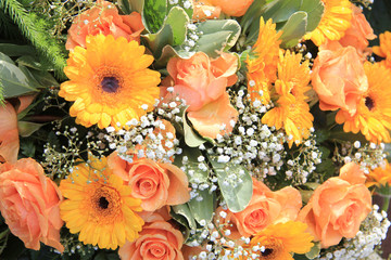 Yellow and orange gerbera and roses