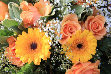 Yellow and orange gerbera and roses