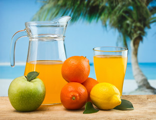 orange juice in a glass on a table