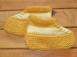 Fototapeta na wymiar Hand knitted baby booties