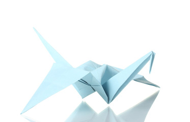 Origami crane  out of the blue paper isolated on white