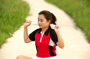 Sport woman of Thai with towel  .