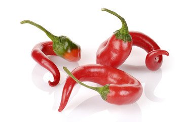 curved red chilli peppers isolated on white