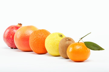 pomegranates and citrus fruits isolated on a white background.