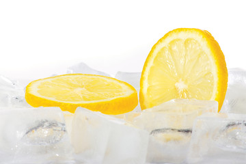 Two slices of fresh lemon on ice cubes