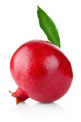 ripe pomegranate with green leaf isolated on white background