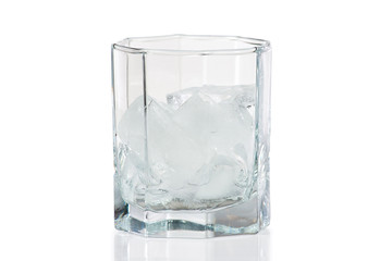 Glass with ice for a cocktail on a white background