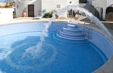 Filling a Swimming Pool with water after cleaning in Spain