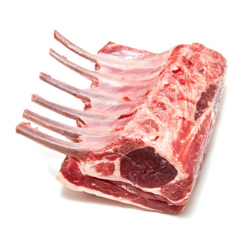 Cutlet or rack of lamb chops isolated on a white studio backgrou