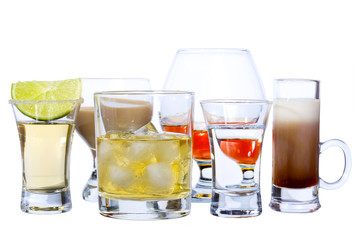 Alcohol drinks on white: tequila, whiskey, cognac...