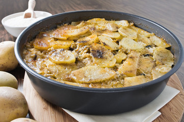 Tiella of potatoes, rice and mussels.