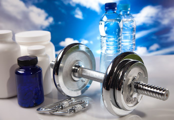 Obraz premium fitness barbell and supplements