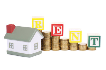 Toy small house and coins in the form of the diagram. concept