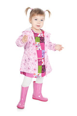 Happy little blonde girl in pink boots over white