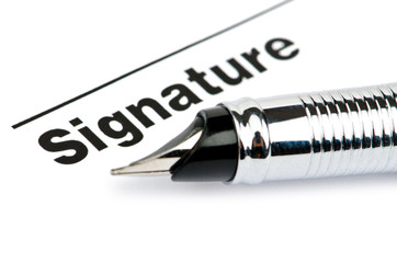 Obraz premium Pen and signature isolated on white