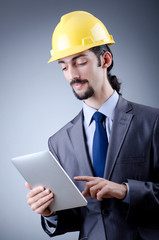 Construction worker working on tablet