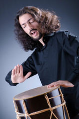Man playing drum in studio