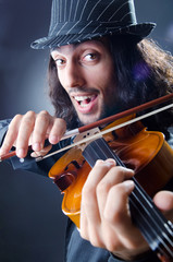 Fototapeta na wymiar Gypsy violin player in studio
