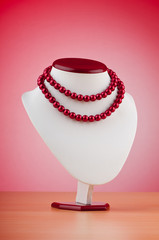 Stand with necklace in fashion concept