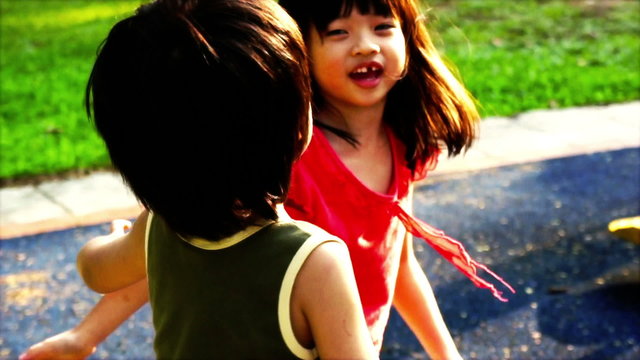 Sibling playing at the playground