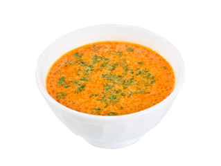 a plate of soup on a white background