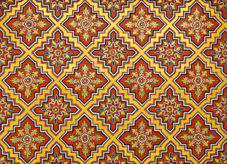 Thai floral pattern painting on ceiling of Buddhist temple