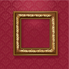 Golden picture frame on the wall of vintage wallpaper