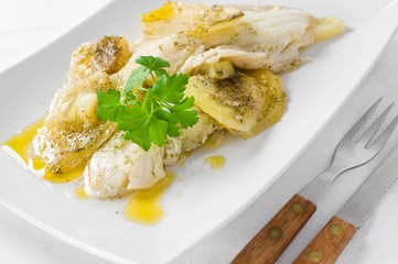 Fish with potatoes.
