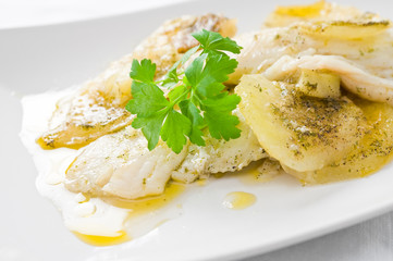 Fish with potatoes.