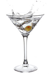 Splashing Martini with olive isolated on white