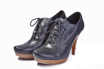 Elegant pair of woman's shoes isolated on a white background