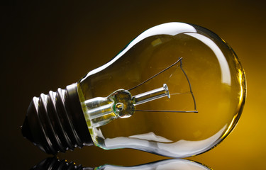 Light bulb on yellow background